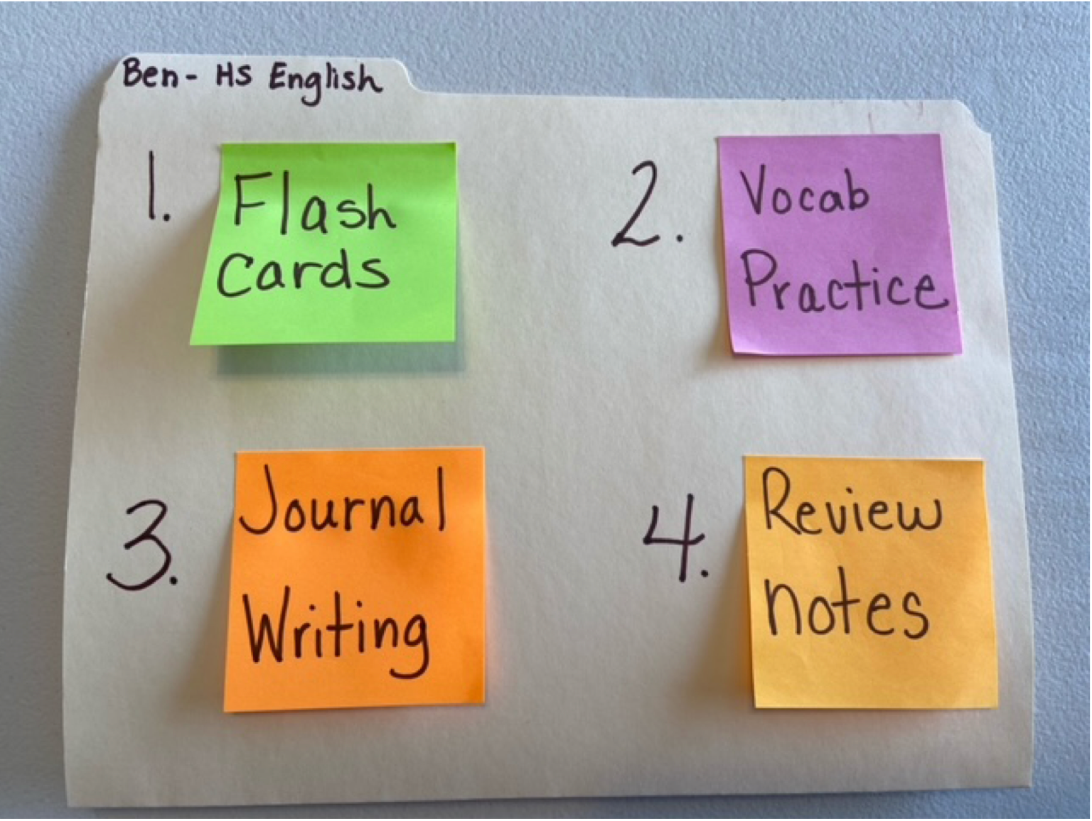 Sample choice board of HS English activities A sample daily choice board showing colored sticky notes on a folder showing “Flash card” “Vocab practice” “Journal writing” and “review notes”
